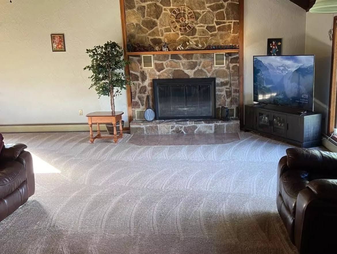 Freshly cleaned living room with finished carpet lines